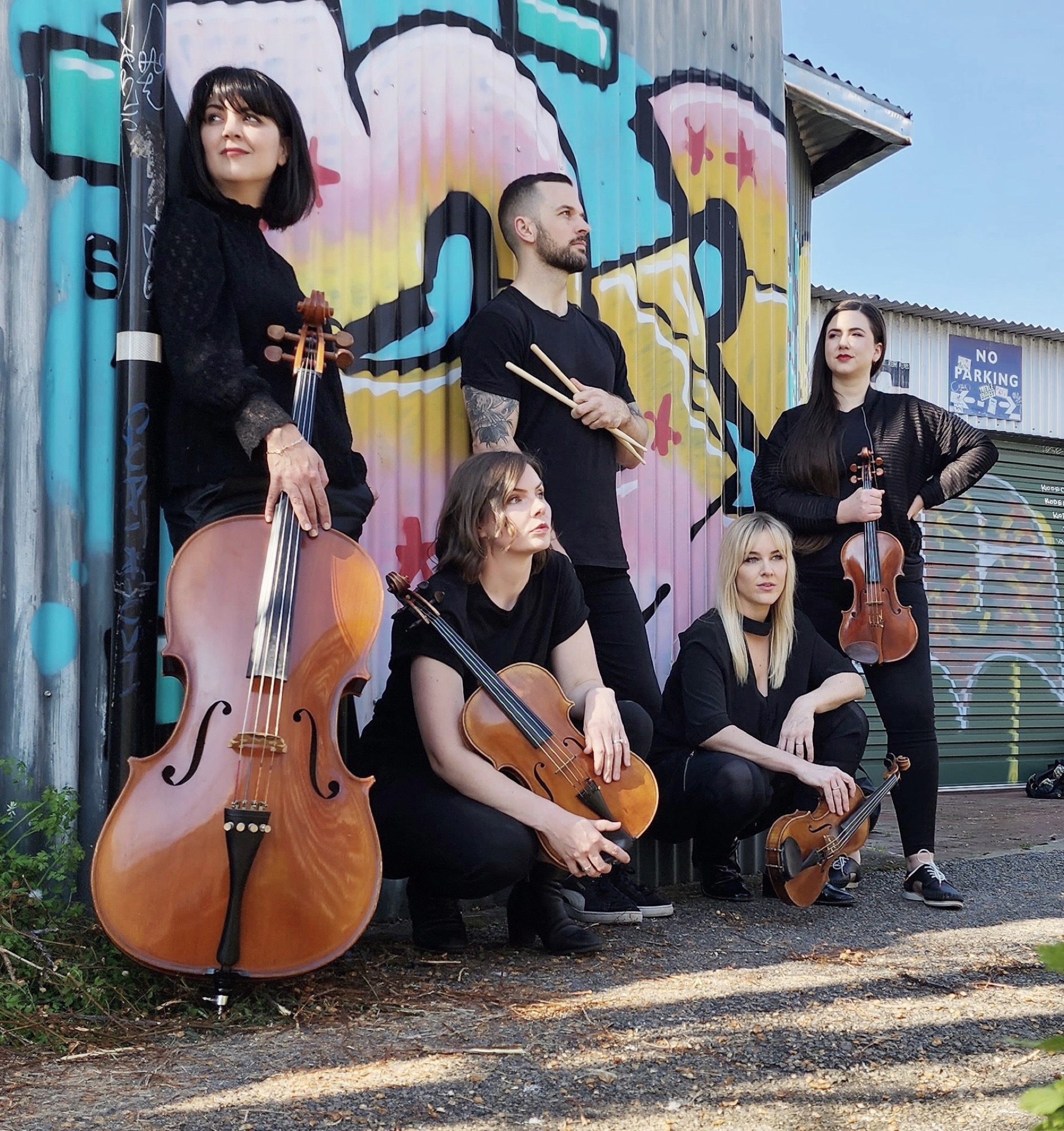 The Aquila band against a graffiti wall