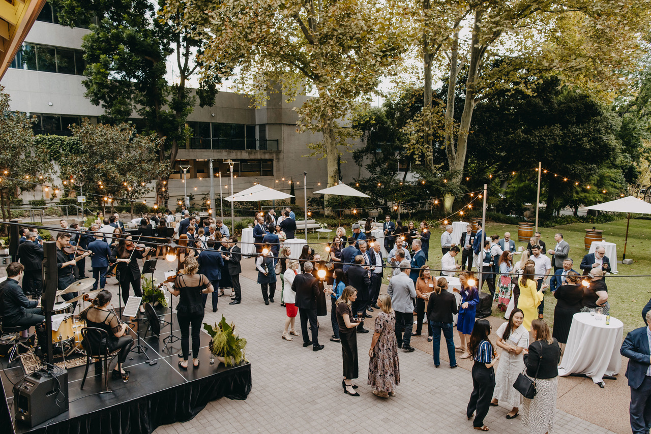 Aquila playing to a crowd at a gala